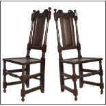 A PAIR OF 17TH CENTURY SOLID OAK HIGH BACK DINING CHAIRS