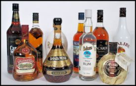 A collection of spirits to include Bacardi, Captain Morgan's Rum, Malibu, Irish Mist, Mozart Liqueur