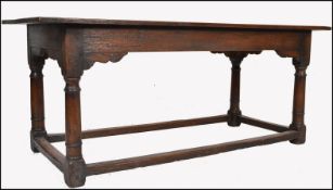 AN 18TH / 19TH CENTURY SOLID PLANKED OAK REFECTORY DINING TABLE