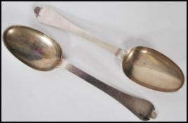 A pair of George I Channel Islands silver trefid spoons, c.1720, maker's mark TC struck once to