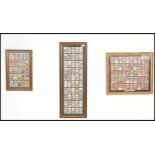 A group of three framed and glazed football related cigarette card sets to include a black and white