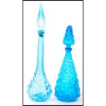 Empoli glass - ' Genie ' - A near matching pair of blue bottle decanters having knobbled design with