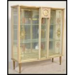 A retro 1950's melamine / formica clock display cabinet, with inset clock to the centre of the