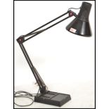 A 20th century retro black anglepoise desk lamp in black colourway having squared weighted base with