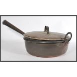 A large 19th century Victorian copper jam pan having a turned wooden conical copper handle an loop