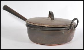 A large 19th century Victorian copper jam pan having a turned wooden conical copper handle an loop