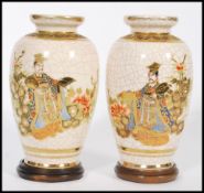 A pair of 20th century Japanese crackle glaze satsuma ware having hand painted and gilded decoration