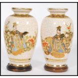 A pair of 20th century Japanese crackle glaze satsuma ware having hand painted and gilded decoration