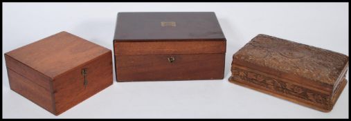 A 19th Century mahogany writing slope, with with engraved brass plaque atop together with an