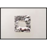 A silver brooch of square form having a deer and a squirrel embossed design. Weight 14.2g.