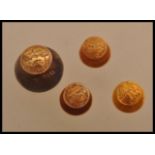 A group of four 18ct gold collar stud buttons having foliate designs. Total weight 4.7 grams