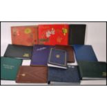 A group of twelve vintage postcard albums and sleeves.