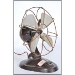 A vintage mid 20th Century bakelite desk fan by Braun,  on shaped stem and circular base. With