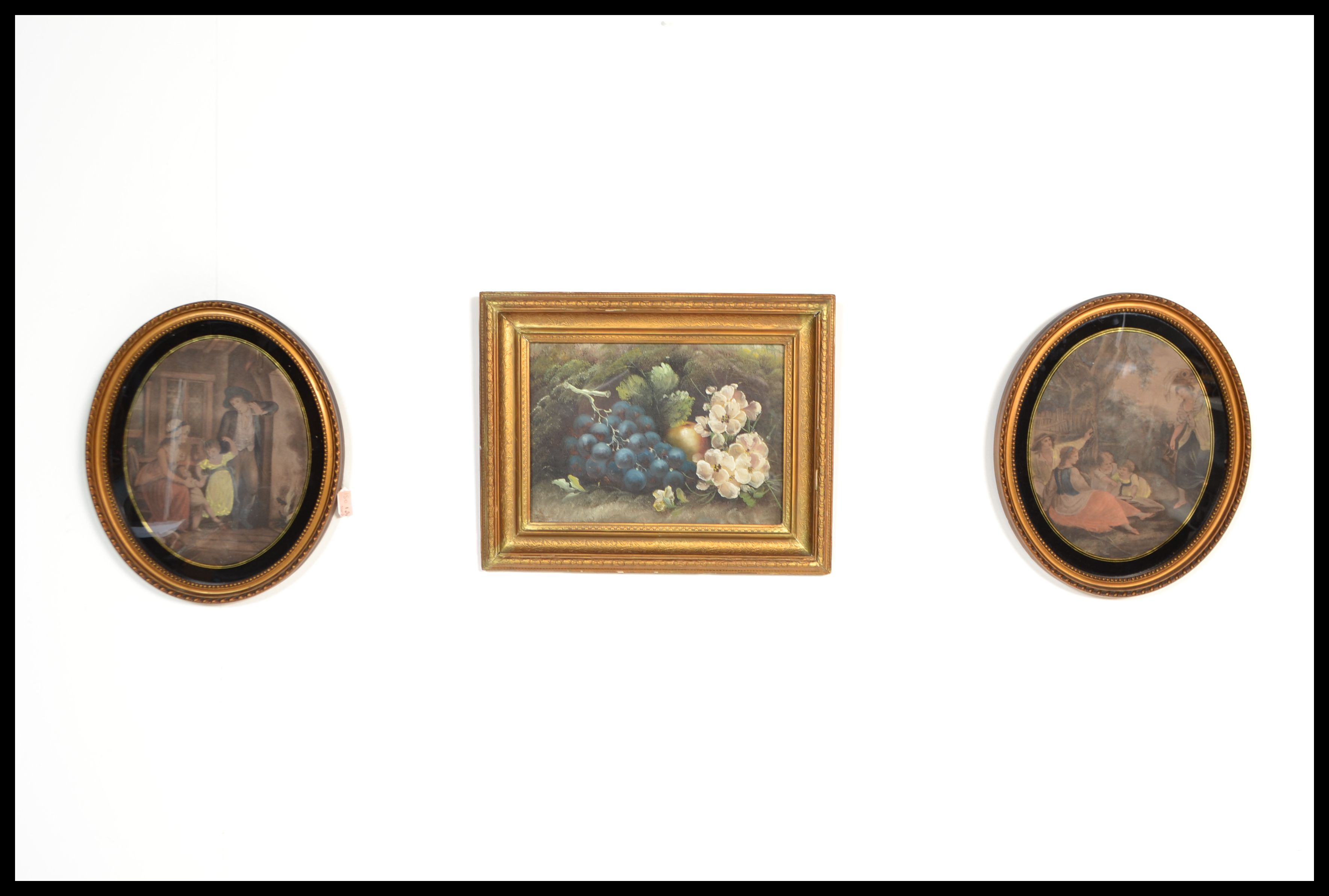 A pair of 19th Century Victorian hand coloured Georgian scene prints in oval moulded gilt frames