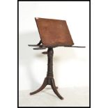 A 19th century Victorian mahogany reading lecturn stand. Raised on splayed legs with turned column