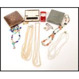 A selection of vintage costume jewellery and boxes to include a multicoloured agate necklace, a