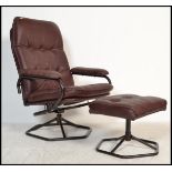 A 1970's retro swivel armchair in the manner of Dux. The chair and stool with ebonised tubular