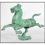 A 19th century Tang Dynasty style Chinese bronze patinated figurine of a warhorse / war horse raised