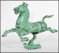 A 19th century Tang Dynasty style Chinese bronze patinated figurine of a warhorse / war horse raised