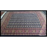 A large  vintage Persian floor carpet Bokhara rug