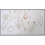 A large collection of vintage costume jewellery strung crystal necklaces of varying lengths, many