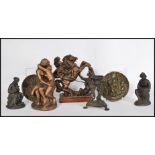 A collection of bronze and bronzed items to include a naked entwined couple, a Chinese incense