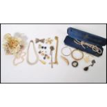 A group of vintage costume and silver jewellery to include pearl necklaces, white metal Cleopatra
