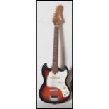 A vintage six string electric guitar by Arbiter having a burned body with white scratch guard and