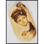 An early 20th century Marine Ivory Scrimshaw panel pendant having a painted portrait of a lady.