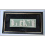 A framed Wedgwood jasper ware / cameo ware wall plaque, on a green ground having raised white