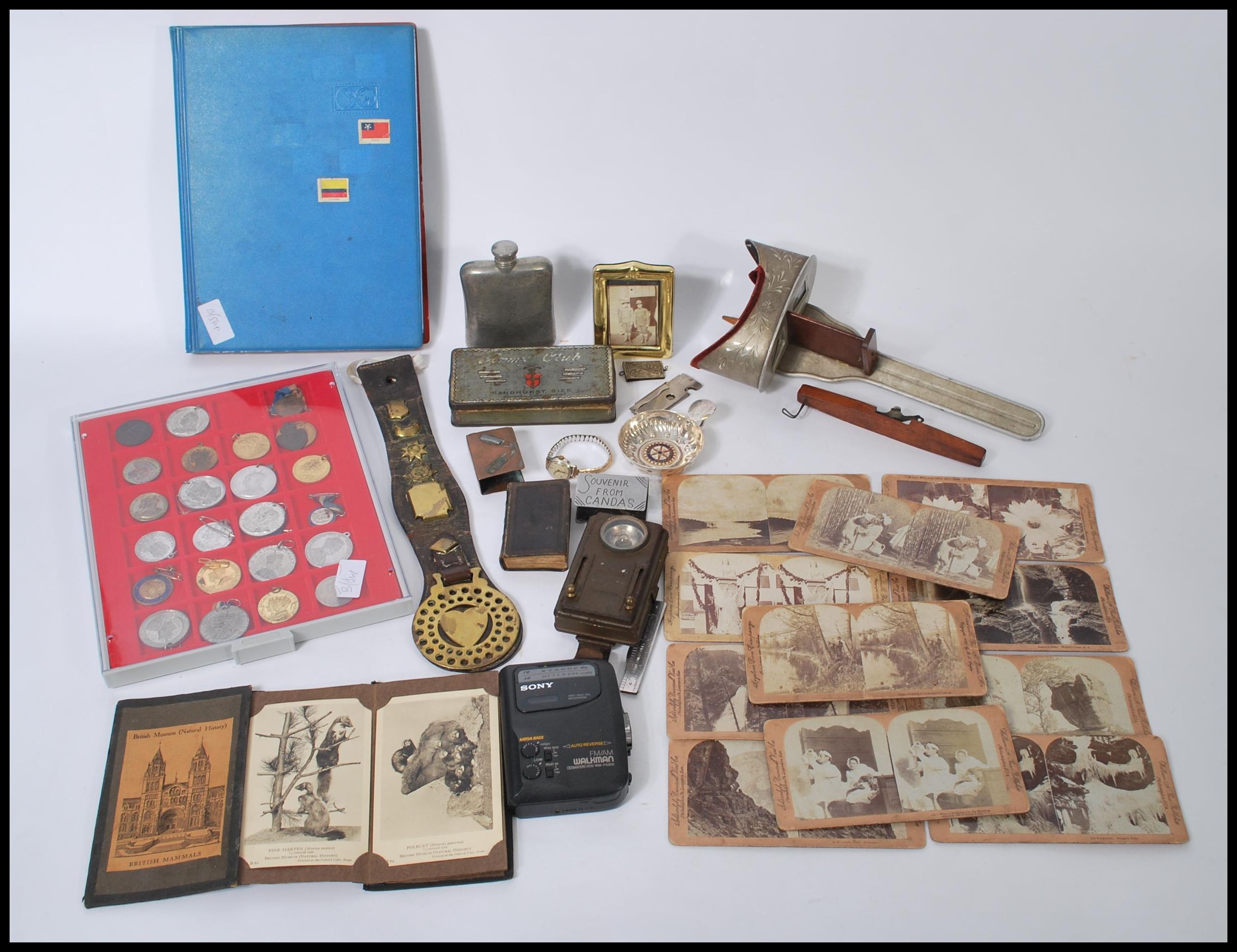 A group of vintage items to include to include horse brasses, coins, trench art etc. Needle case