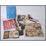 A group of vintage items to include to include horse brasses, coins, trench art etc. Needle case