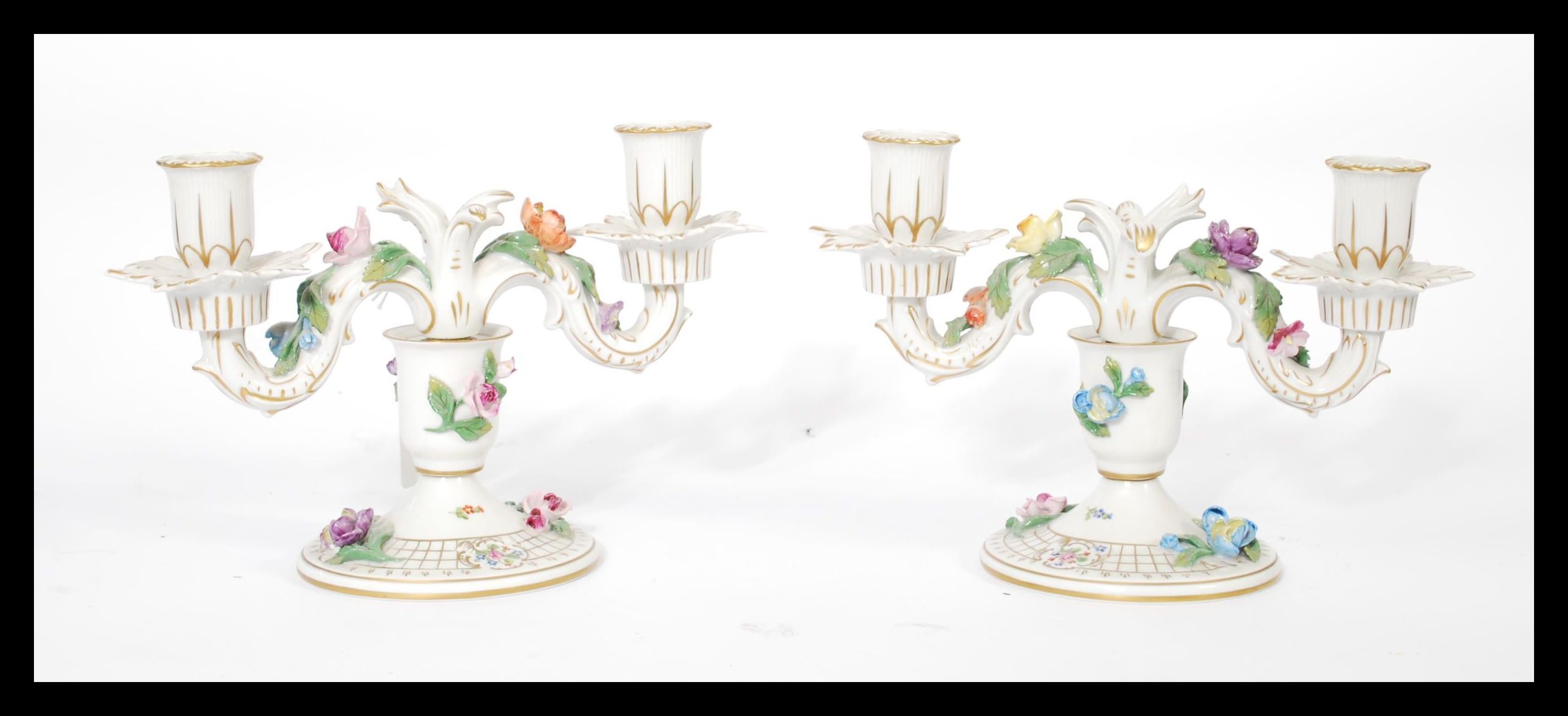 A pair of Dresden porcelain double sconce candelab