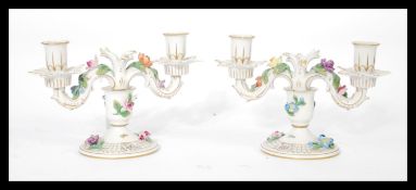 A pair of Dresden porcelain double sconce candelab