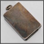 An early 20th century silver hallmarked sprung vesta case in the form of a matchbox with bale loop