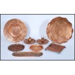 A collection of vintage early 20th Century Arts and Crafts copper dishes / trays in the manner of