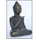 A 19th century Chinese bronze statue figure of a Buddha modelled in the Lotus position. Measures