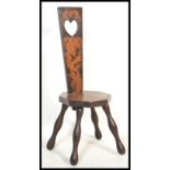 A 19th century Victorian mahogany inlay spinning chair having a pierced heart back and scrolled