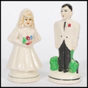 A pair of unusual early Noritake novelty condiments in the form of a newlywed couple. The bride