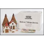A 20th century collectors  Heritage Village Collection ‘ Village Dickens Series ’ ceramic house /