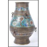 A large early 20th Century oriental Chinese champleve bronze enamelled vase of bulbous form having