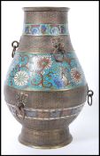 A large early 20th Century oriental Chinese champleve bronze enamelled vase of bulbous form having