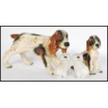 A pair of 19th Century Staffordshire ceramic dog figurines modelled as poodles together with a