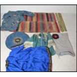 A collection of 19th century Chinese clothing to include a blue silk shirt with flowers and