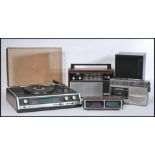 A group of vintage music items to include a Sharp Solid State Stereo Record Player and three