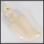 An early 20th century Japanese ivory tear catcher pendant in the form of a heart. Measures 6.5cm