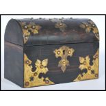 A 19th century coromandel wood dome work box having large armorial brass mounts to the domed lid and