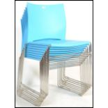 A set of eight contemporary stacking dining chairs, moulded seat pads and back rests in one section,