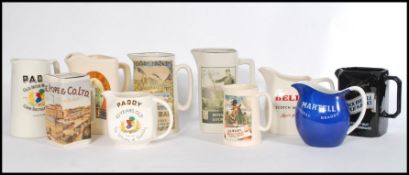 A collection of vintage retro 20th Century Wade ceramic drink barrels to include Gin, Scotch,