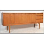 A retro 20th Century teak wood sideboard / credenza, three cupboards with a run of three drawers